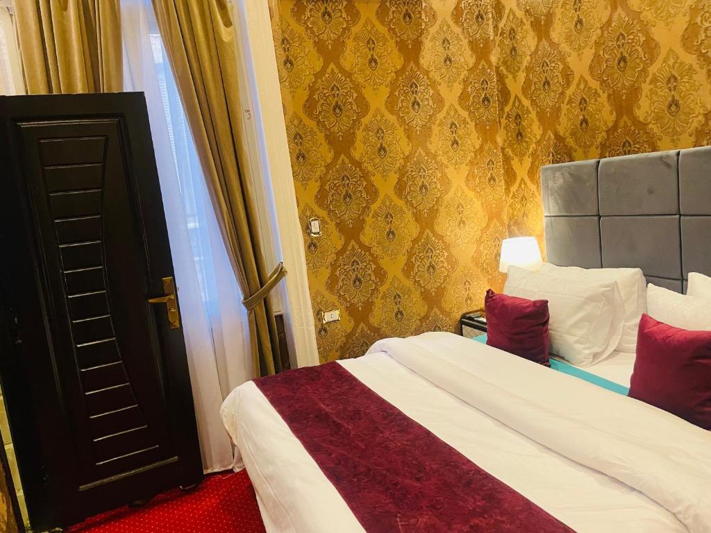 Postel nebo postele na pokoji v ubytování Cairo Inn