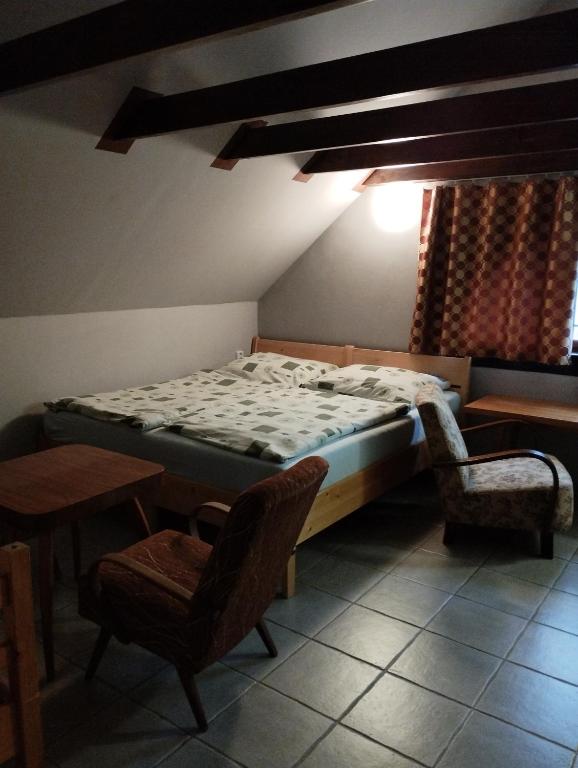 Postel nebo postele na pokoji v ubytování Vitaj Kamaráde - Ubytování U Jožky