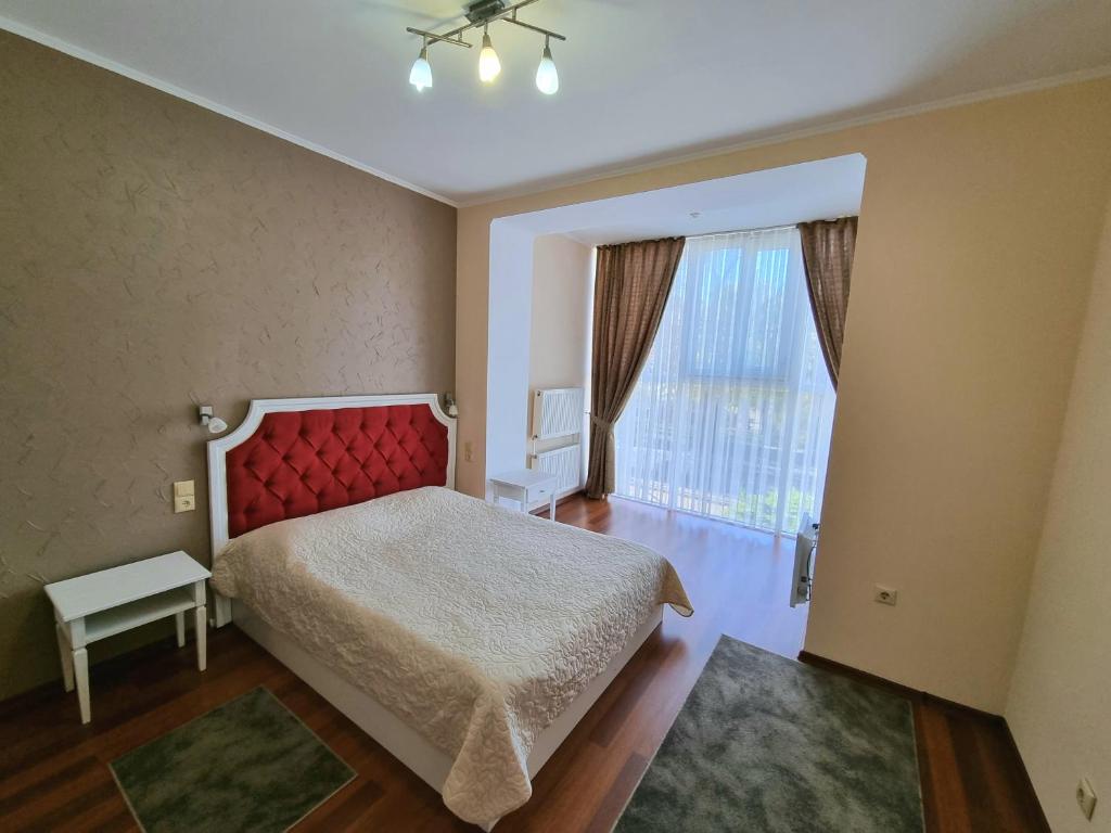 Postel nebo postele na pokoji v ubytování Helen Hotel