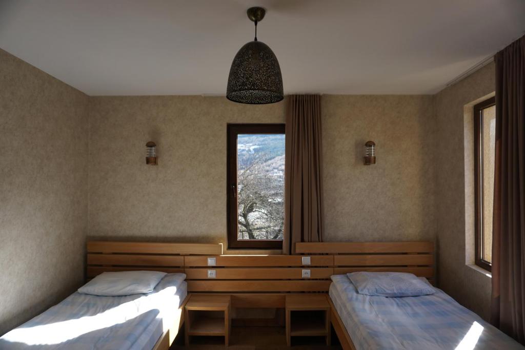Postel nebo postele na pokoji v ubytování Mestia Panorama