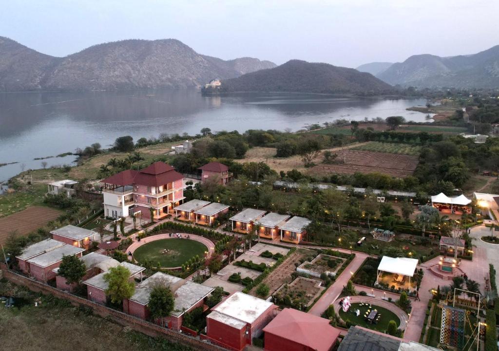 an aerial view of a resort next to a body of water at DESI THATH RESORT in Alwar