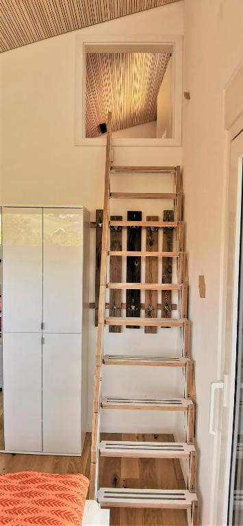 Postel nebo postele na pokoji v ubytování Exklusives Holzhaus mit Bergbahn - Baden-Baden im Schwarzwald