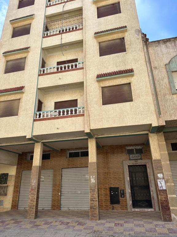 a large building with doors and windows on it at GHIZLAN apartment TETOUAN in Tétouan