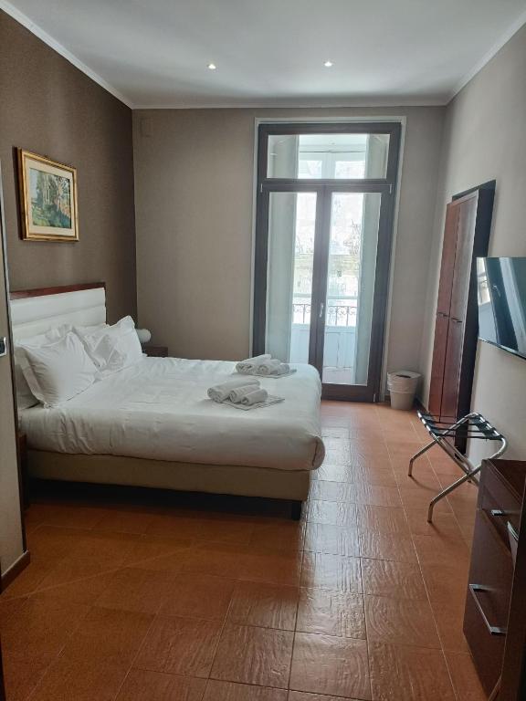 Postel nebo postele na pokoji v ubytování Il Duomo