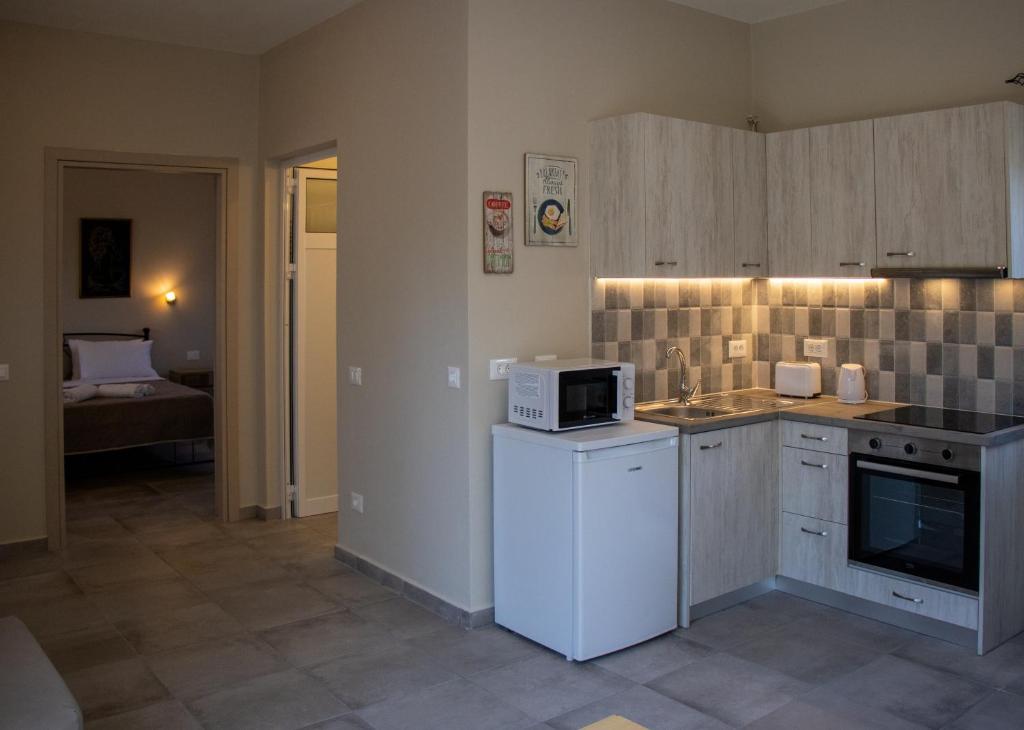Kuchyň nebo kuchyňský kout v ubytování Casa De Rosa Apartments & Studios