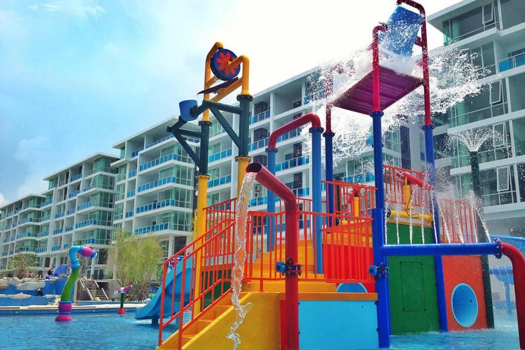 a playground in front of a large apartment building at My Resort Condo in Hua Hin E204 in Hua Hin
