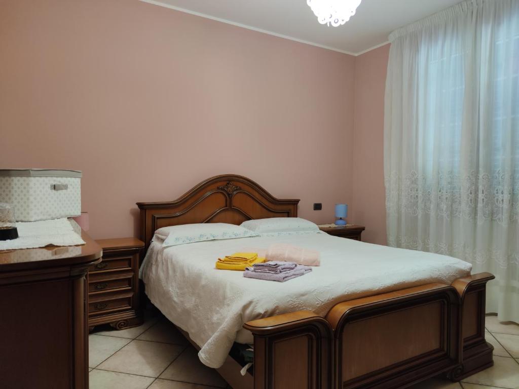 A bed or beds in a room at Relax in collina a due passi dal mare