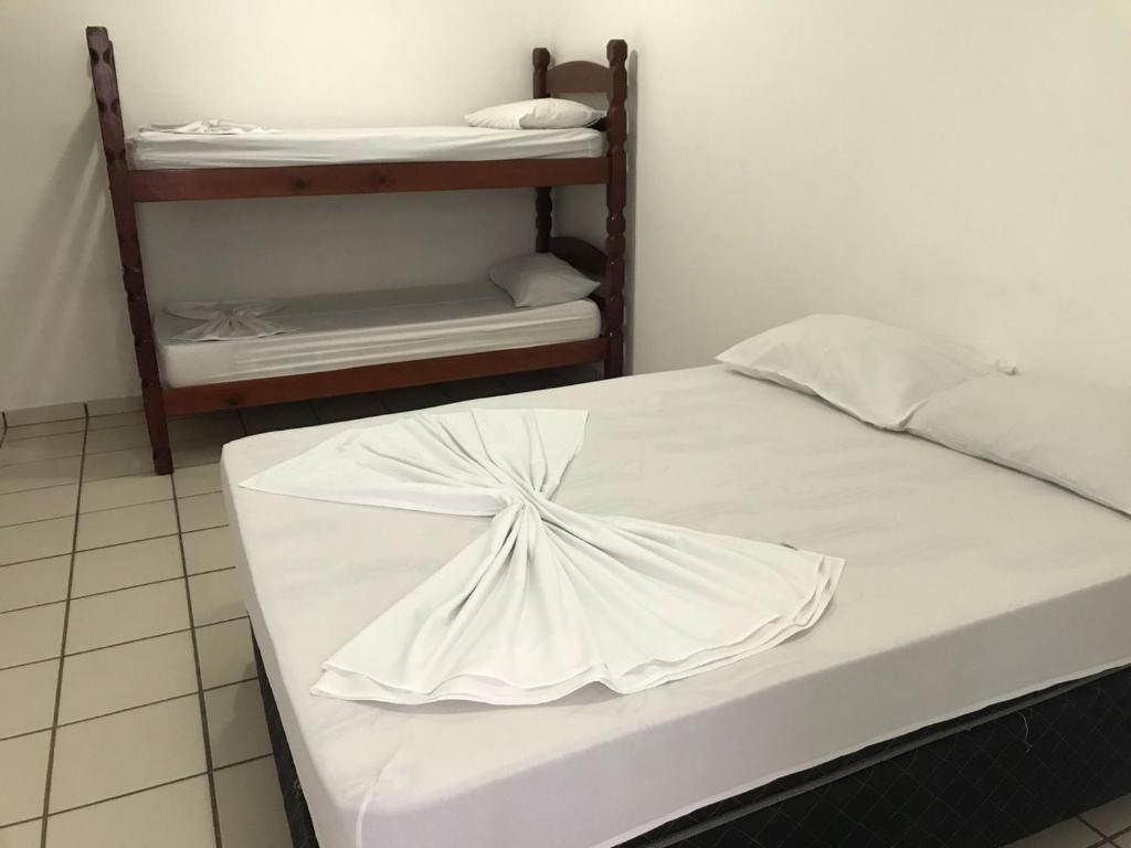 Cama ou camas em um quarto em Pousada dos Eletricitarios