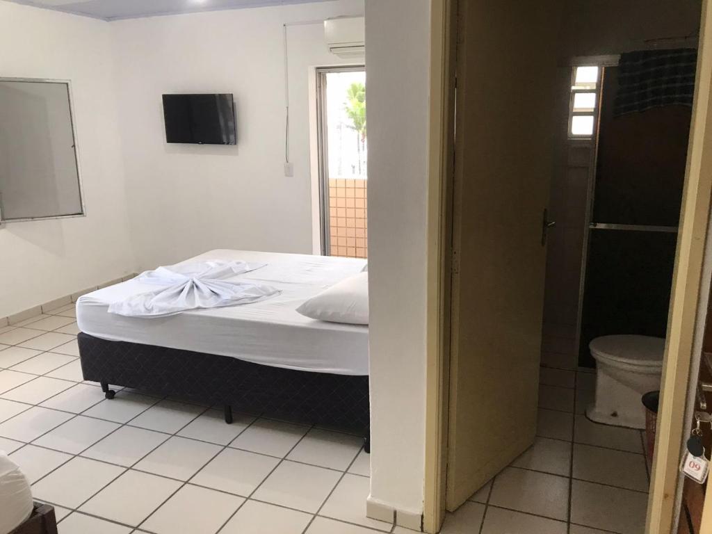 Cama ou camas em um quarto em Pousada dos Eletricitarios