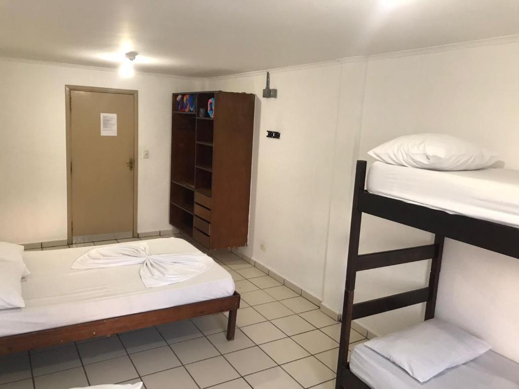 Cama ou camas em um quarto em Pousada dos Eletricitarios