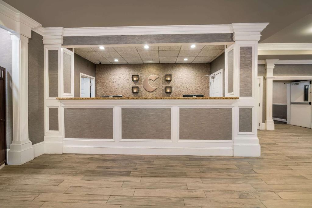 a large lobby with a counter in a building at Comfort Inn & Suites Plattsburgh - Morrisonville in Plattsburgh