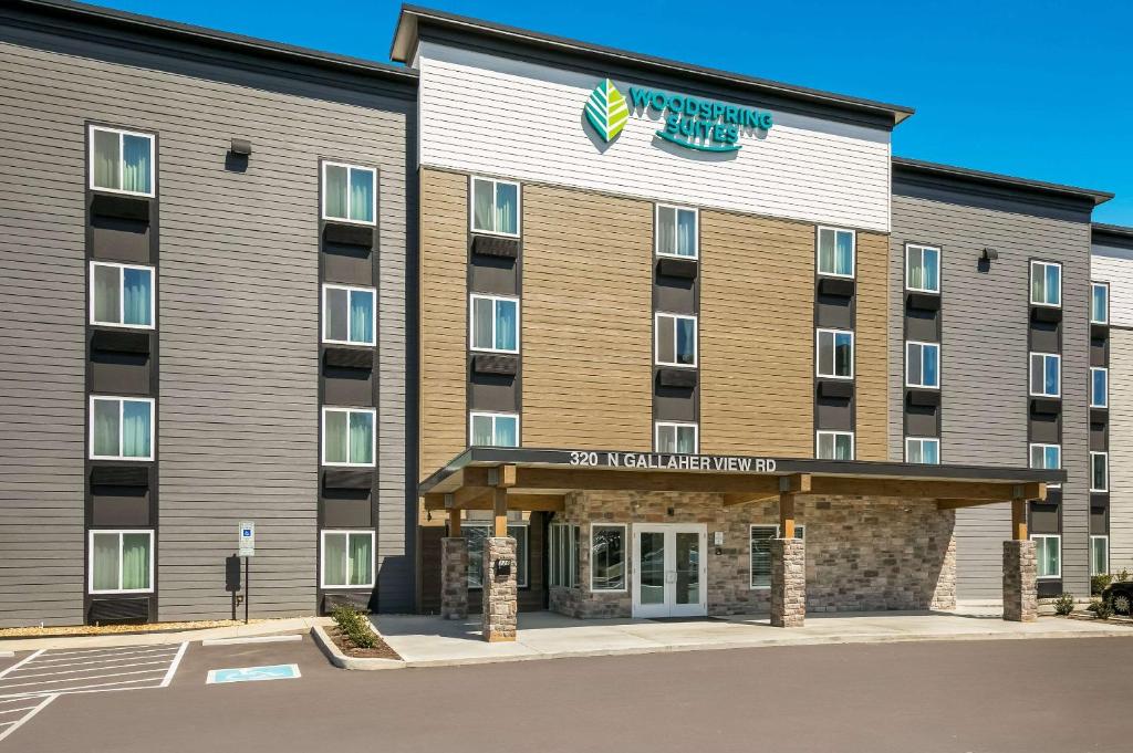 an image of the front of a hotel at WoodSpring Suites Knoxville - Cedar Bluff in Knoxville