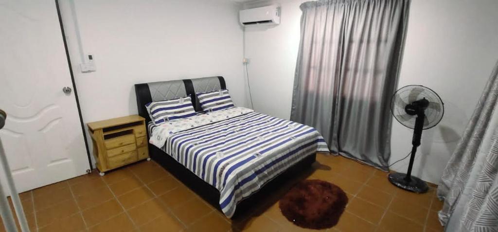 Katil atau katil-katil dalam bilik di AL JANNAH COTTAGE HOUSE