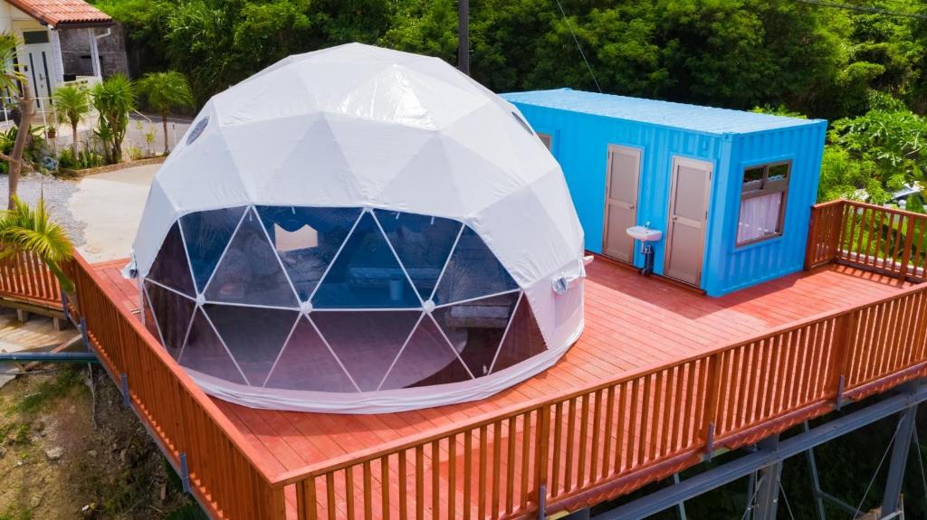 a dome tent on a deck with a house at HIKARI DOME - Vacation STAY 89725v in Teruma