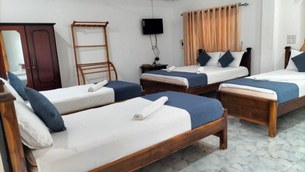 Postel nebo postele na pokoji v ubytování Hotel Sun Blue