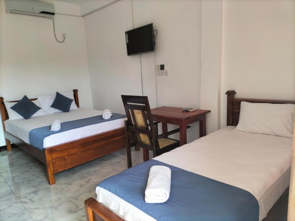 Postel nebo postele na pokoji v ubytování Hotel Sun Blue