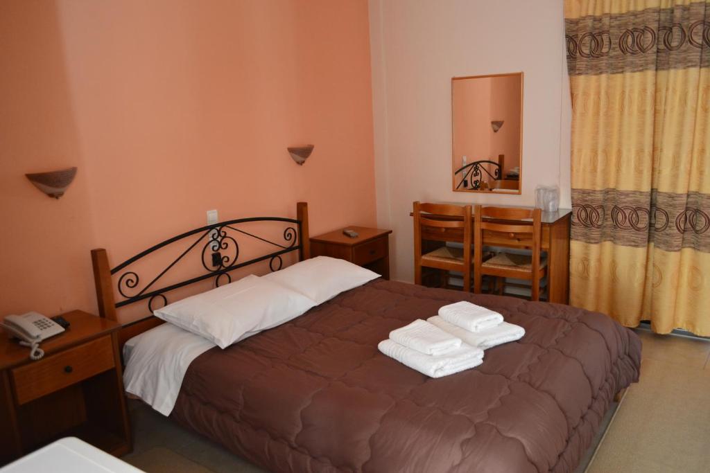 Postel nebo postele na pokoji v ubytování Anixis Hotel