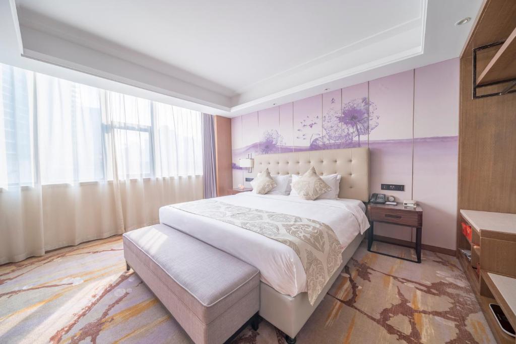 Voodi või voodid majutusasutuse Wuhan Hongguang Hotel toas