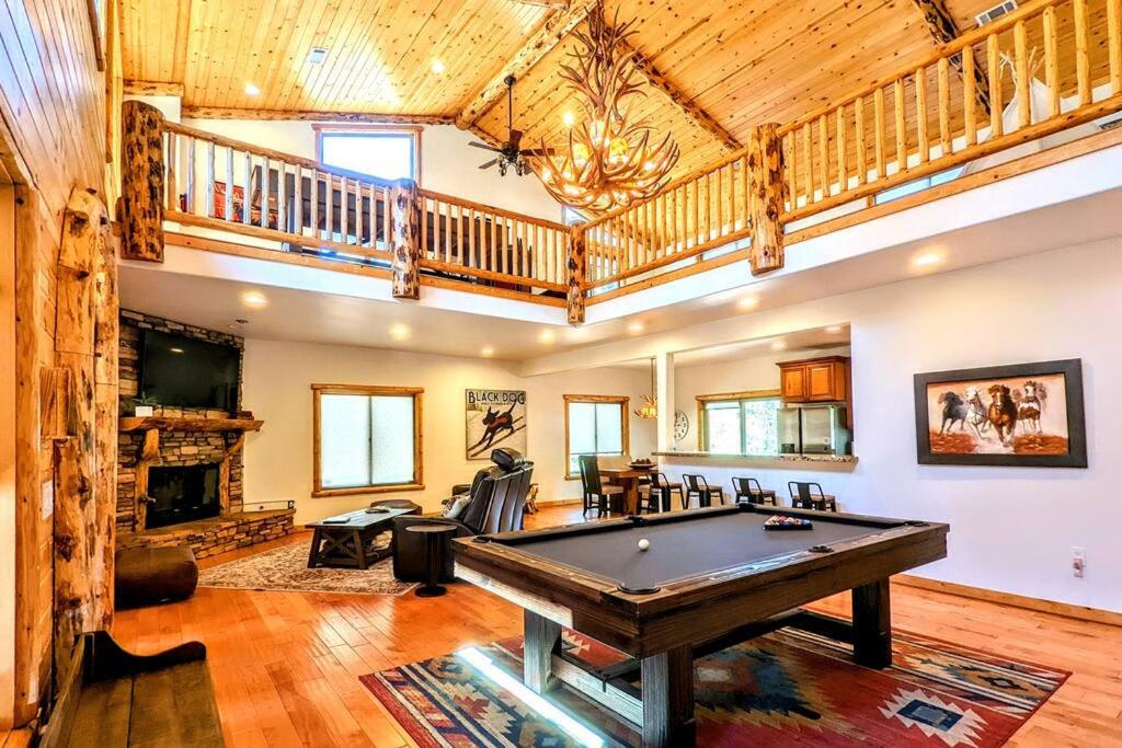 a large living room with a pool table in it at Bel Air of Big Bear - Fun & Tech & Massive Cabin in Big Bear City