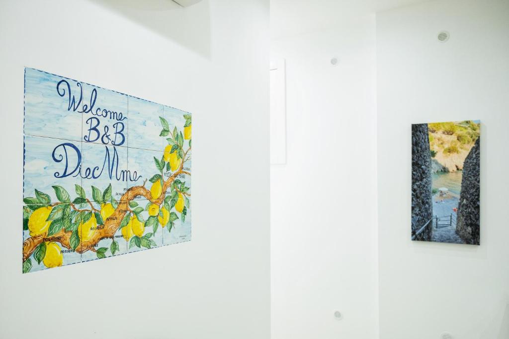 two posters on a door with a sign that reads welcome to big dog mine at B&B DieMme Amalfi Coast in Vietri sul Mare