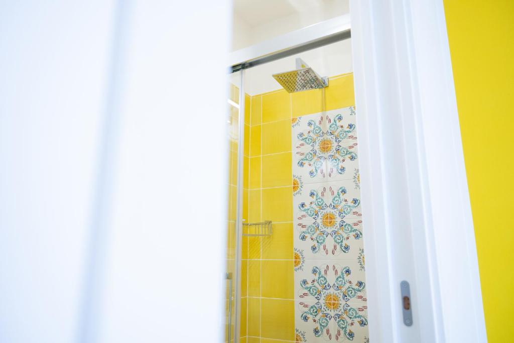 a shower with a shower curtain in a bathroom at B&B DieMme Amalfi Coast in Vietri sul Mare