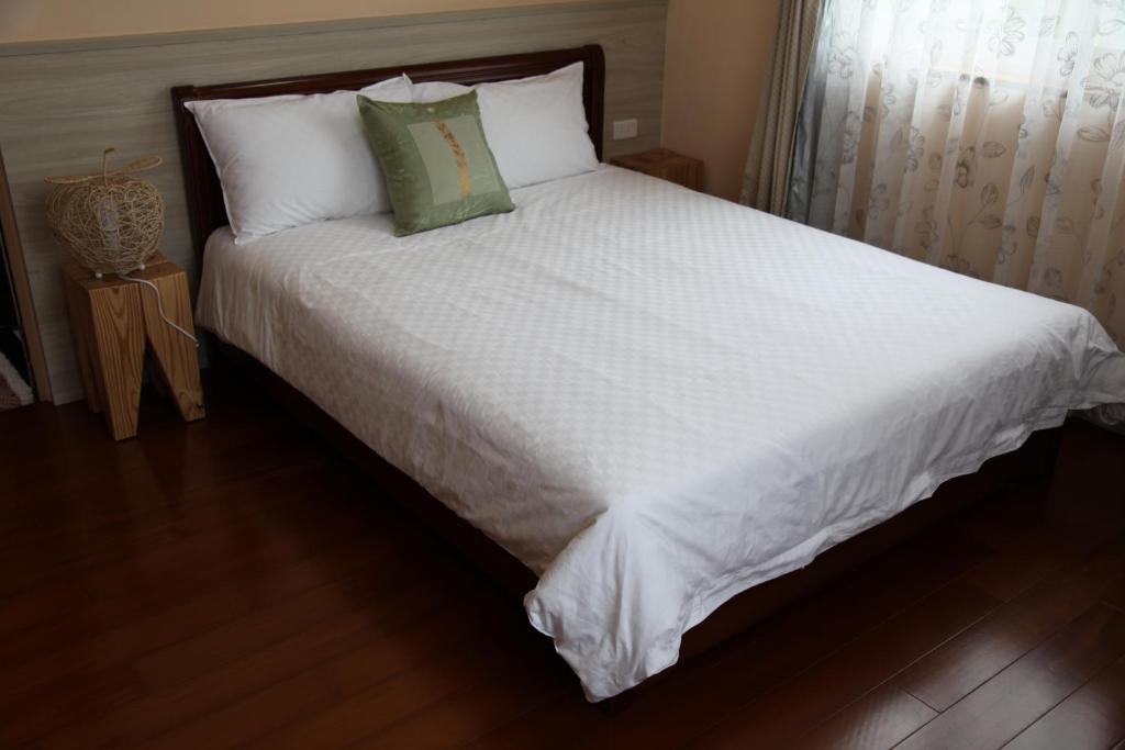 Cama o camas de una habitación en Dong Hua Dream House