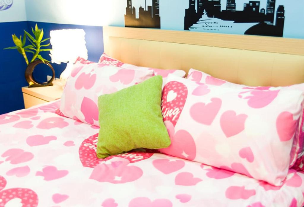Postel nebo postele na pokoji v ubytování Free World B&B