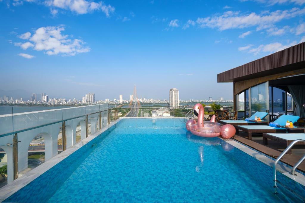 a swimming pool on the roof of a building at Gold Plaza Hotel - Located just 100m from the Walking Street in Danang