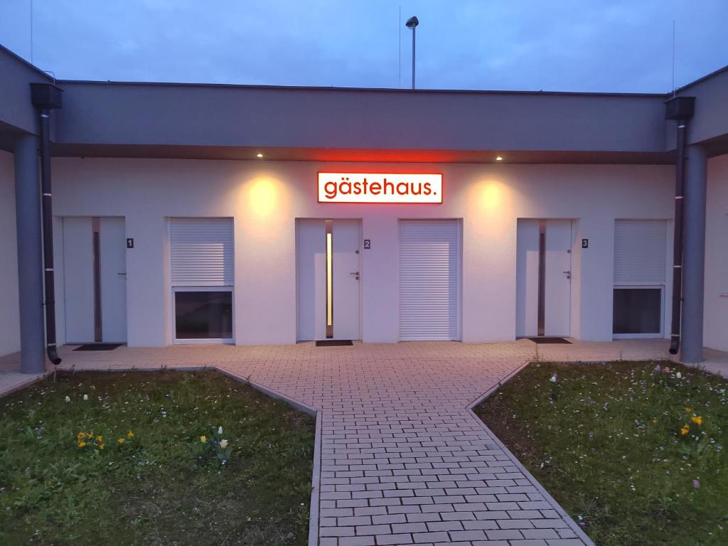 a building with a sign that reads osteosynthesis at gästehaus-bernstein in Marchegg