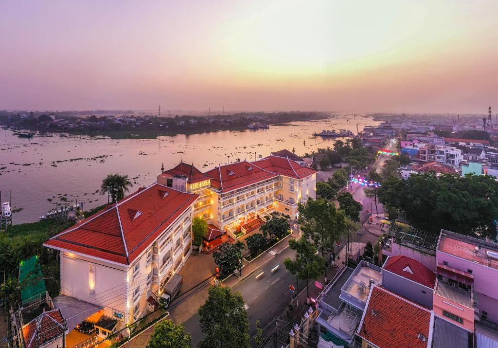 an overhead view of a city with a river and buildings at Victoria Chau Doc Hotel in Chau Doc