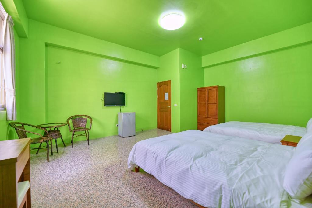 Postel nebo postele na pokoji v ubytování Chunfa B&B
