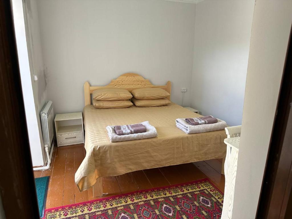 En eller flere senge i et værelse på MUXSIN Hotel