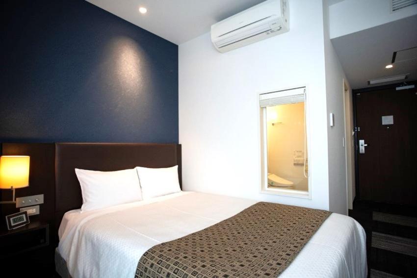 Postel nebo postele na pokoji v ubytování Hotel Bestland