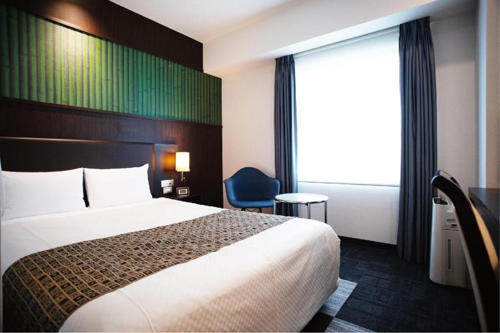 Postel nebo postele na pokoji v ubytování Hotel Bestland