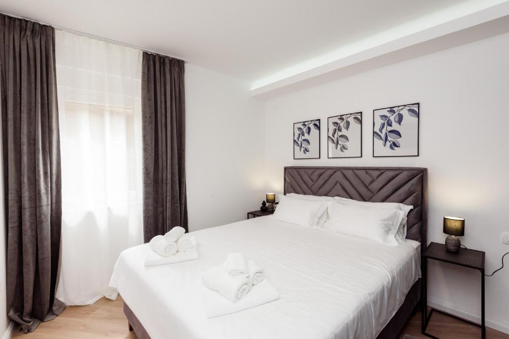 Postel nebo postele na pokoji v ubytování Apartman Olimp