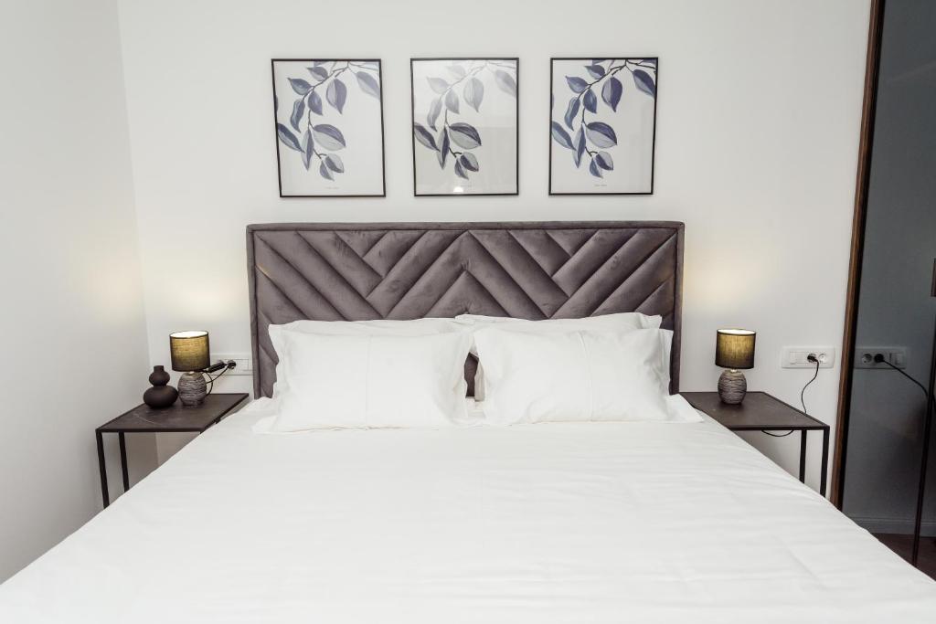 Ένα ή περισσότερα κρεβάτια σε δωμάτιο στο Apartman Olimp