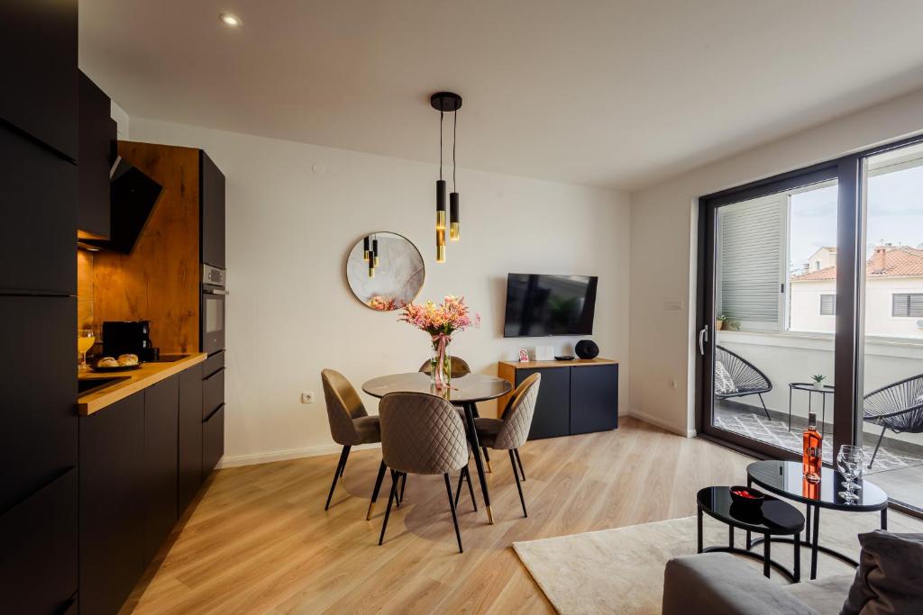TV a/nebo společenská místnost v ubytování Apartman Olimp