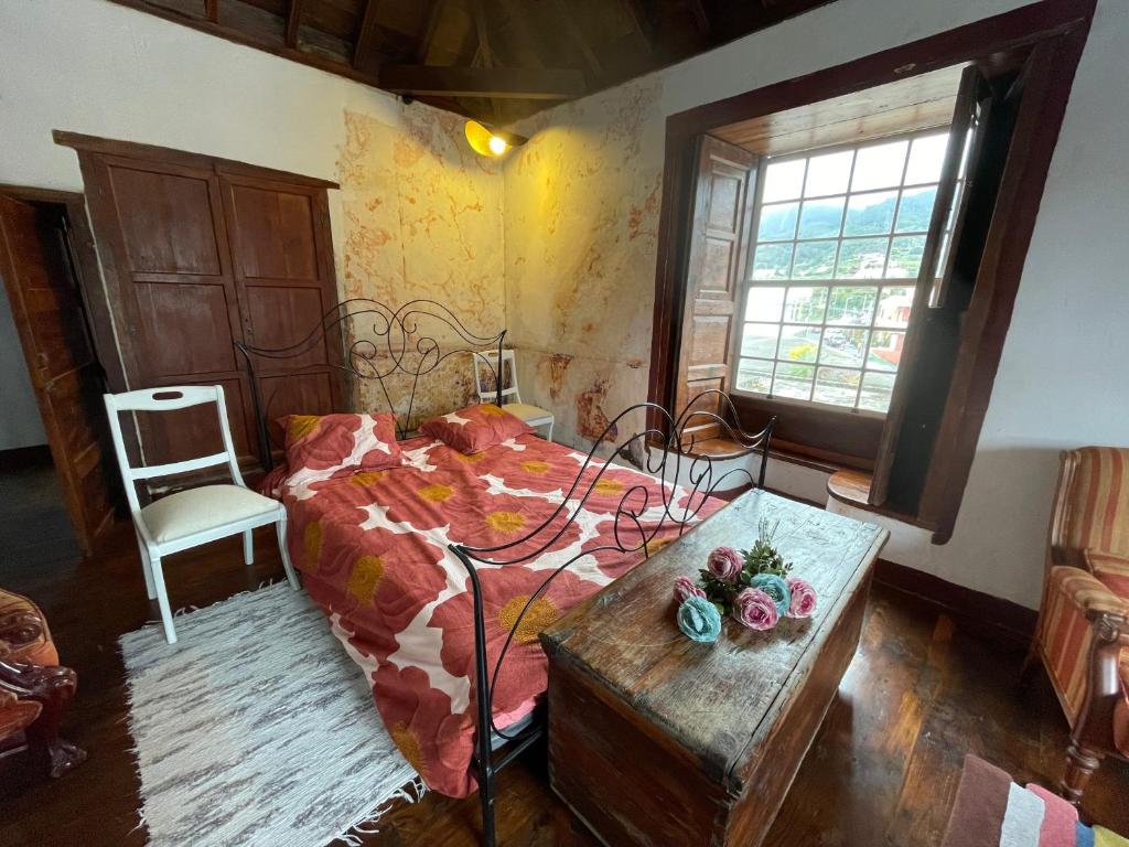 Postel nebo postele na pokoji v ubytování Casa Madalita