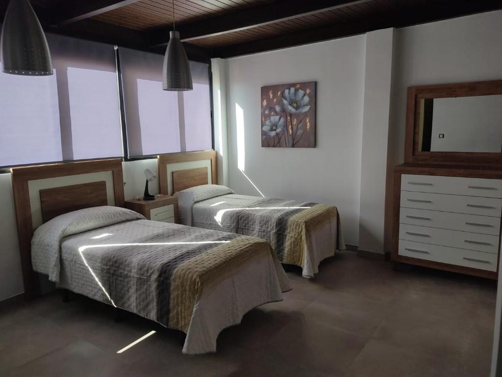 Posteľ alebo postele v izbe v ubytovaní Apartamentos Séneca junto al Centro