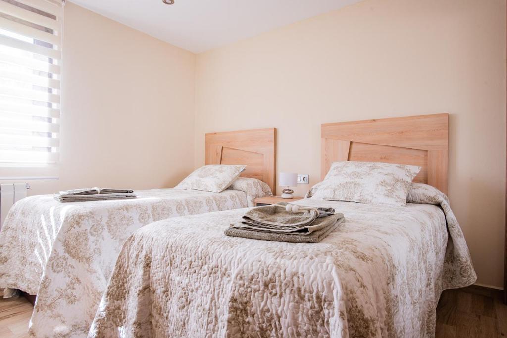 Postel nebo postele na pokoji v ubytování Apartamentos La Cortina