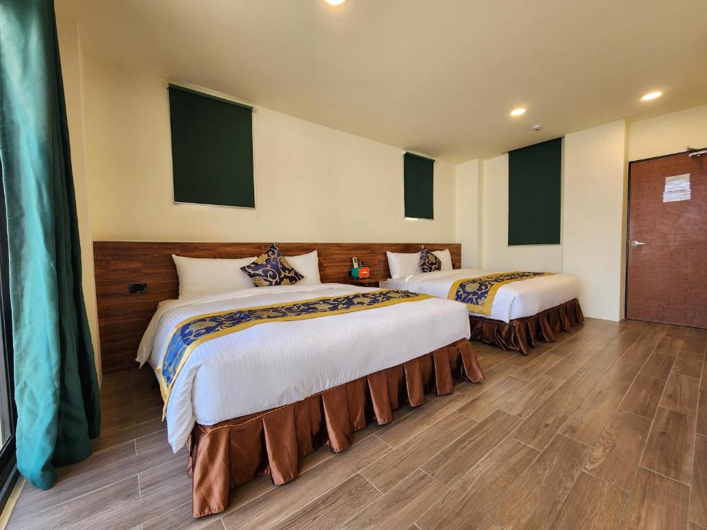 Postel nebo postele na pokoji v ubytování Penghu Dayou View B&B