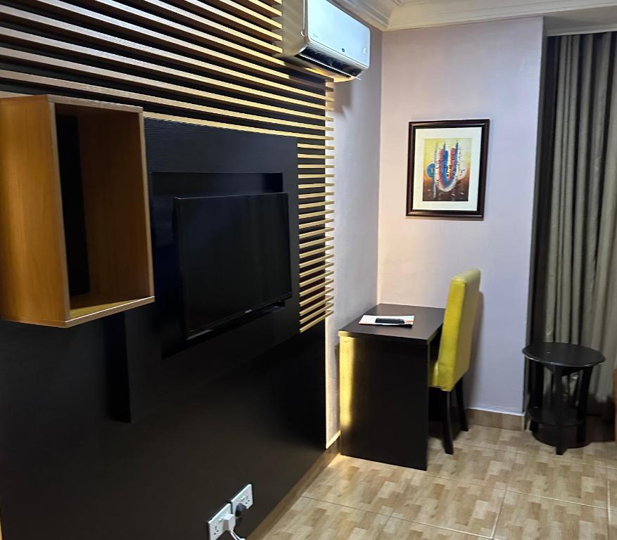 TV a/nebo společenská místnost v ubytování Msquare Hotel GRA