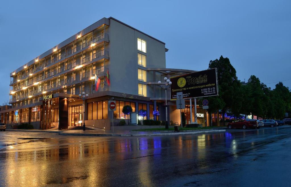 a building on the side of a street at night at Hotel Russia in Tiraspol