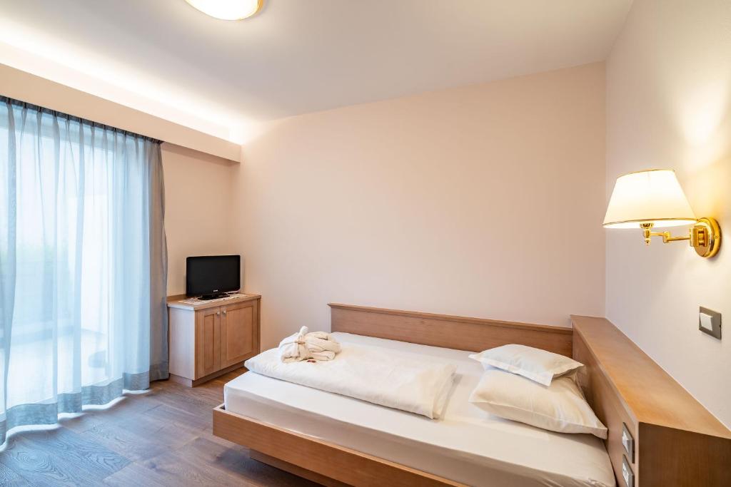 Postel nebo postele na pokoji v ubytování Hotel Wessobrunn