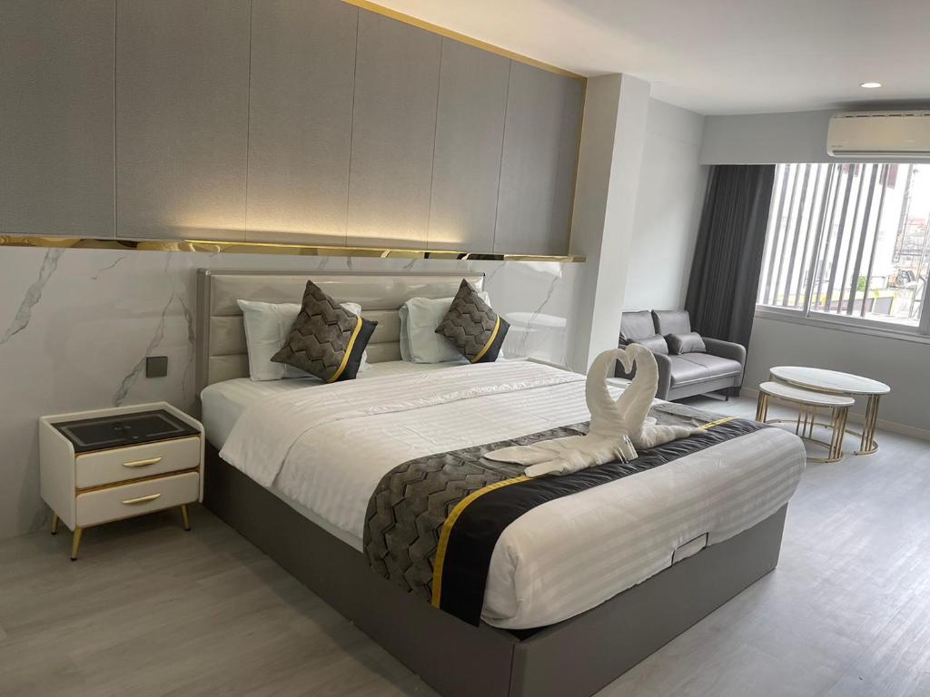 Ένα ή περισσότερα κρεβάτια σε δωμάτιο στο Berich Hotel
