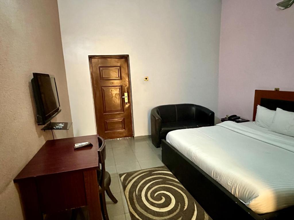 Postel nebo postele na pokoji v ubytování Whitehouse Msquare Hotel