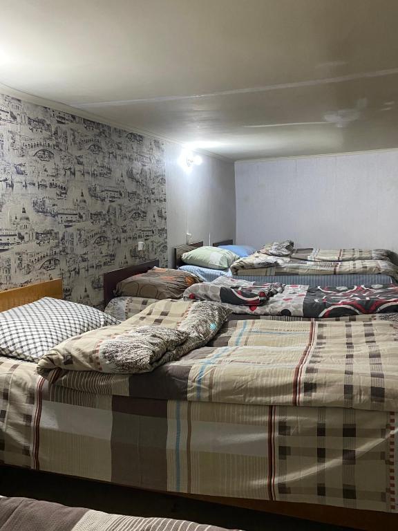Postel nebo postele na pokoji v ubytování T Rooms