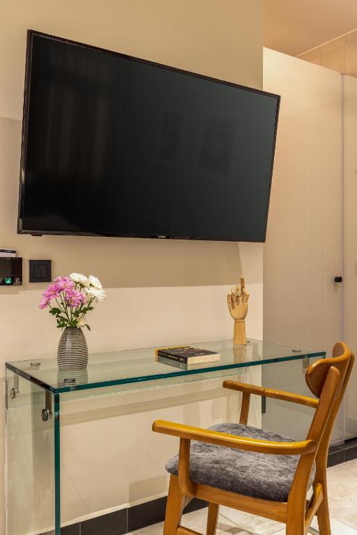 TV a/nebo společenská místnost v ubytování Flâneur