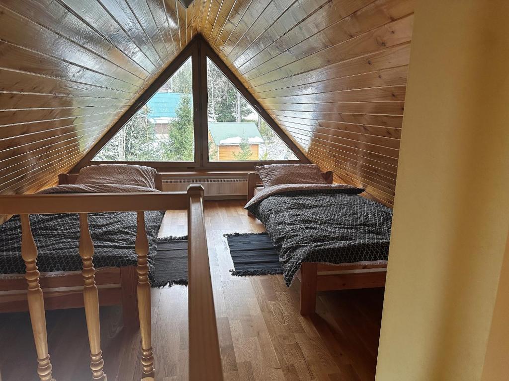 Postel nebo postele na pokoji v ubytování Chata Diana