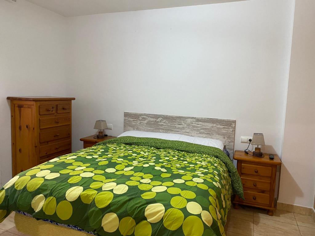 A bed or beds in a room at Joan XXIII Apartment